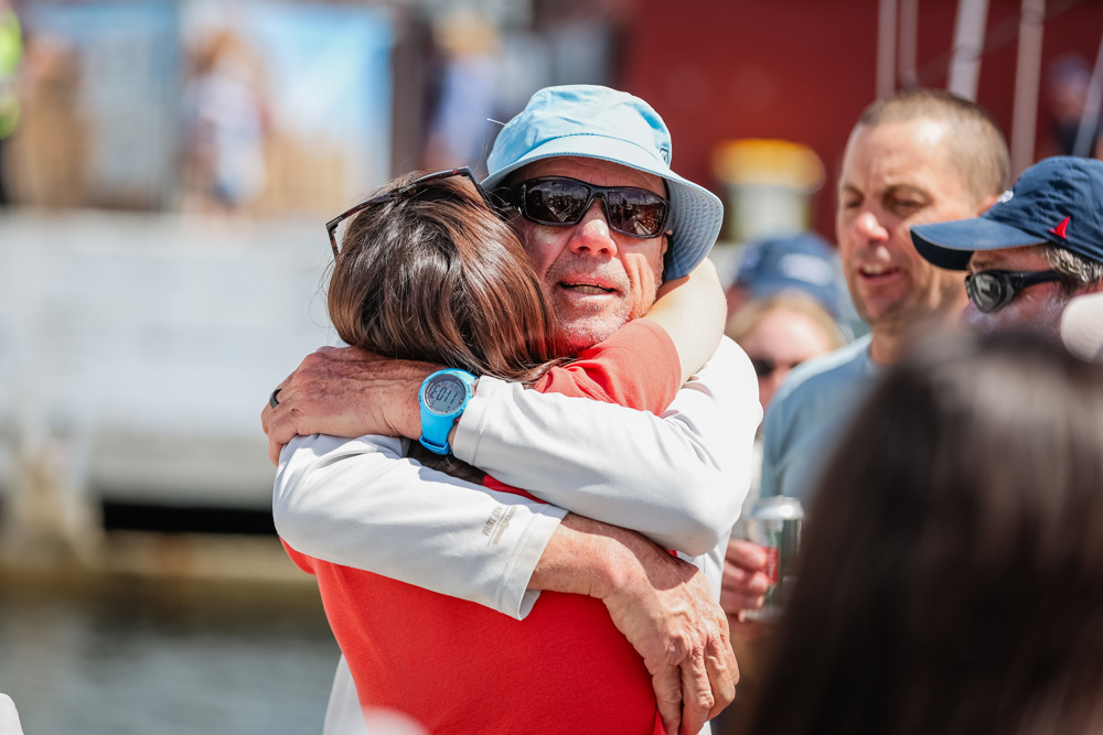 Jan Sholten (co-skipper Disko Trooper_Contender Sailcloth) being welcomed to the dock.     Image: CYCA | Salty Dingo