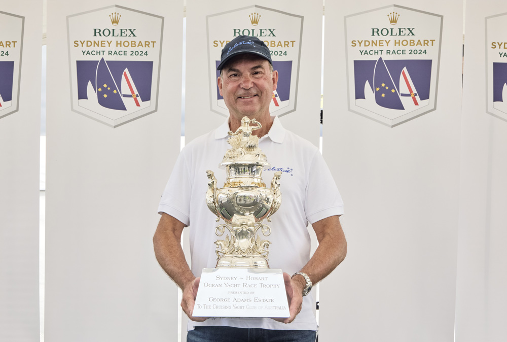 Sam Haynes, skipper of Celestial V70 and CYCA Commodore, with the Tattersall Cup for Overall Winner of the 2024 Rolex Sydney Hobart Yacht Race.    