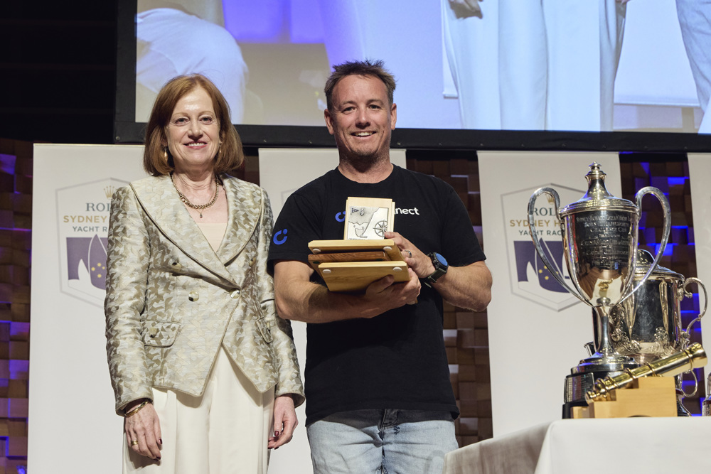 LawConnect, 1st Yacht Out of Sydney Heads (Jack Rooklyn Memorial Trophy), 1st Yacht Due South of Tasman Island (F&J Livingstone Trophy), Line Honours Winner (John H Illingworth Trophy), 2nd IRC Division 0 and 2nd IRC Overall (City of Hobart Trophy, Bass Strait Cup, Solo Trophy).  Presented by Her Excellency, The Hon. Barbara Baker, Governor of Tasmania to Christian Beck, represented by Dylan Clarke.    