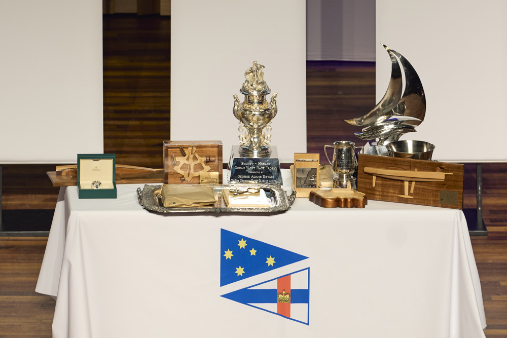 The Rolex Yacht-Master Timepiece and some of the other trophies, including the George Adams Tattersall Cup, awarded to the winning boat Celestial V70.    