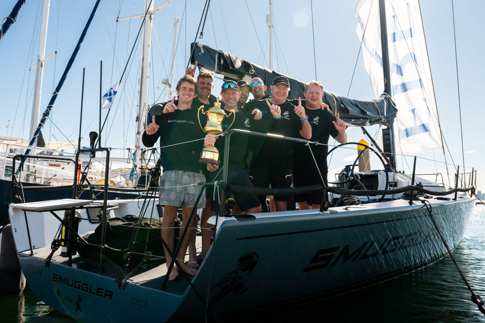 Smuggler crew with the Peter Rysdyk trophy for the overall winner    Image: CYCA | Ashley Dart
