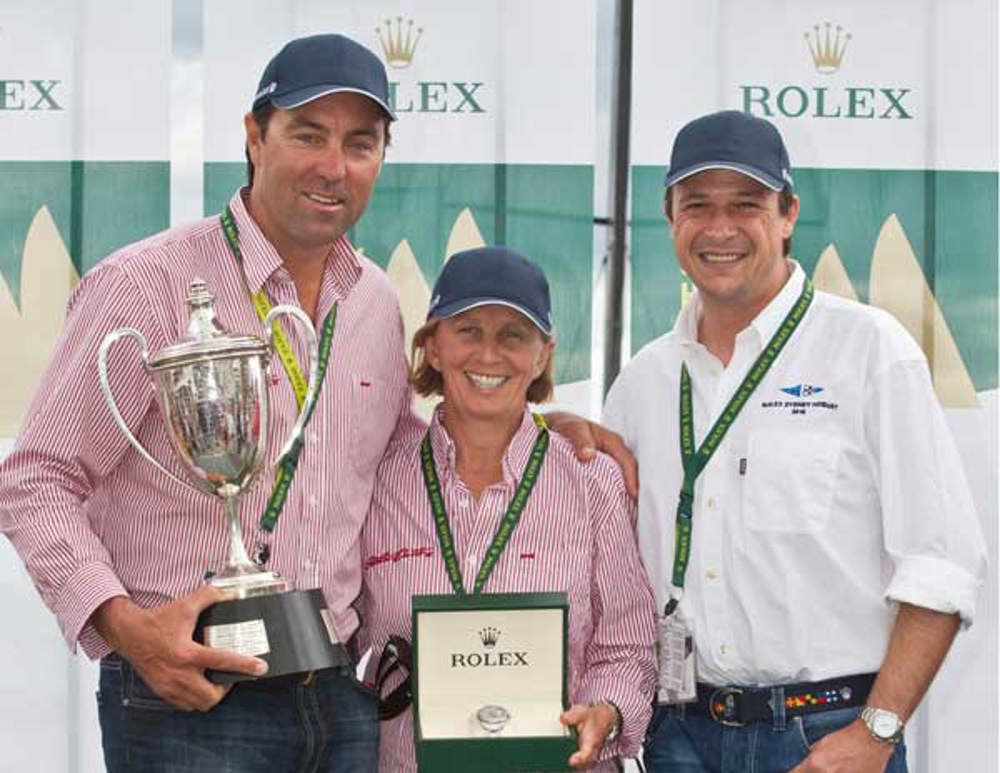 Rolex Sydney Hobart Line Honours Presentation (L to R): Mark Richards, skipper of Wild Oats XI holding the JH Illingworth trophy, Adrienne Cahalan, co-navigator of Wild Oats XI with the Rolex Yacht-Master timepiece, and Patrick Boutellier, Rolex Australia