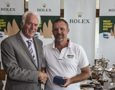 A crew member from Merit accepts the trophy for Merit's third in PHS division 1 from Damon Thomas, Lord Mayor of Hobart