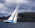 One DLL crew head up the Derwent River towards the line at the end of the Clipper Round the World race, a category of the Sydney to Hobart yacht race at Constitution Dock in Hobart, Monday, Dec. 30, 2013. (AAP Image/Heath Holden) NO ARCHIVING, EDITORIAL USE ONLY