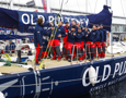 The Old Pulteney crew celebrate dockside at the end of the Clipper Round the World race, a category of the Sydney to Hobart yacht race at Constitution Dock in Hobart, Monday, Dec. 30, 2013. (AAP Image/Heath Holden) NO ARCHIVING, EDITORIAL USE ONLY