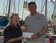 Angela Matthews, Secretary, St Helens Marine receiving the CYCA SOLAS pledge of $20,000 from Commodore Matt Allen, Chairman of CYCA SOLAS Trusts