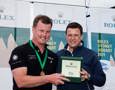 Anthony Bell accepts the Rolex timepiece from Patrick Boutellier, Rolex Australia