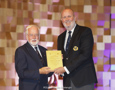 Cruising Yacht Club of Australia Commodore Paul Billingham presenting a Meritorious Service Award to RYCT Past Commodore Alastair Douglas, OAM