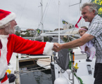 Santa visits the New Zealand crew of Akatea