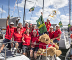 Roger Hickman and his Wild Rose crew celebrate their arrival in Hobart