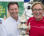 CYCA Commodore Howard Piggott present Darryl Hodgkinson, Victoire’s owner/skipper, with the Tattersall’s Cup