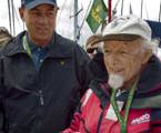 John Walker, the oldest skipper at 86 in the Rolex Sydney Hobart 2008, being presented with a cake to mark his 25th Hobart for himself and his boat