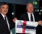 Immediate Past Commodore Clive Simpson presenting newly elected RYCT Commodore Graham Taplin with his burgee