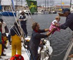 Bill Wells, crew member of Telcoinabox Merit, greets his daughter Lucy on arrival in Hobart