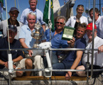 The crew of Love & War with the Tattersalls Cup and Rolex watch