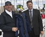 Matt Allen, Chairman of CYCA SOLAS Trusts and Brett Smith, Tasmanian Air Rescue Trusts, with one of the immersion suits that the SOLAS Trusts donation funds were used to purchase
