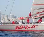 The crew of Wild oats XI flaking the main after finishing