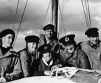 Wayfarer crew in the 1945 Sydney Hobart race.  L to R: Geoff Ruggles, Len Wilsford, Brigadier Arthur Mills, Peter Luke (at rear),  Bill Lieberman, Fred Harris