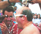 Tony Cable having a VB shower after the Sovereign double win the 1987 Sydney Hobart