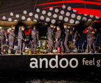 Andoo Comanche crew celebrate just after crossing the finish line