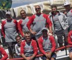 The crew of Chutzpah after finishing the Rolex Sydney Hobart (Drew and Bruce second and third from left on rail)