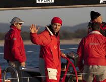 Skipper Mark Richards gives a wave and a smile after taking line honours in the 2011 Sydney Gold Coast Yacht Race