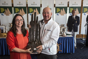 A crew member from Celestial Assistance Dogs accepts the Tasports trophy (1st ORCi Div 2) from the Hon. Michelle O'Byrne