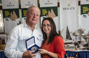 Jim Holley, Aurora, collects his 25 Hobart medallion from the Hon. Michelle O'Byrne
