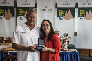 Bob Thomas, AFR Midnight Rambler, collects his 25 Hobart medallion from the Hon. Michelle O'Byrne