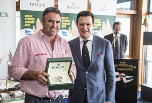 John Hildebrand, Wild Oats XI, is presented with the Rolex Yacht-Master by Patrick Boutellier, General Manager, Rolex Australia