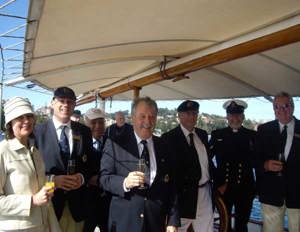 Associates President Pam Messenger with Commodore Matt Allen and guests onboard the start vessel Boomerang