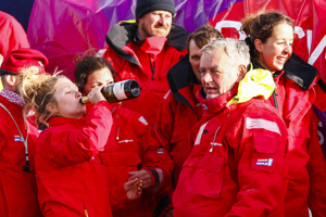 The crew of Derry~Londonderry~Doire celebrate being the first to sail up the Derwent river as a part of the Clipper Round the World race, a category of the Sydney to Hobart yacht race at Constitution Dock in Hobart, Monday, Dec. 30, 2013. (AAP Image/Heath Holden) NO ARCHIVING, EDITORIAL USE ONLY