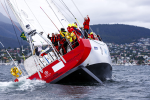 Team Great Britain make their way towards Constitition Dock as a part of the Clipper Round the World race, a category of the Sydney to Hobart yacht race at Constitution Dock in Hobart, Monday, Dec. 30, 2013. (AAP Image/Heath Holden) NO ARCHIVING, EDITORIAL USE ONLY