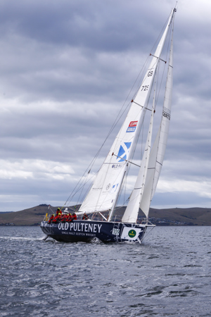The Old Pulteney boat makes its way towards the finish line at the end of the Clipper Round the World race, a category of the Sydney to Hobart yacht race at Constitution Dock in Hobart, Monday, Dec. 30, 2013. (AAP Image/Heath Holden) NO ARCHIVING, EDITORIAL USE ONLY
