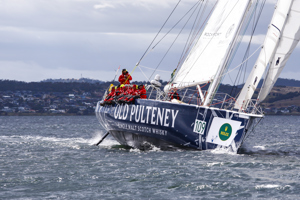 The Old Pulteney boat makes its way towards the finish line at the end of the Clipper Round the World race, a category of the Sydney to Hobart yacht race at Constitution Dock in Hobart, Monday, Dec. 30, 2013. (AAP Image/Heath Holden) NO ARCHIVING, EDITORIAL USE ONLY