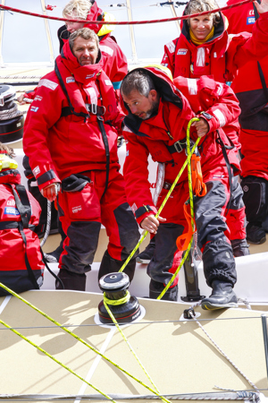 One DLL crew head up the Derwent River towards the line at the end of the Clipper Round the World race, a category of the Sydney to Hobart yacht race at Constitution Dock in Hobart, Monday, Dec. 30, 2013. (AAP Image/Heath Holden) NO ARCHIVING, EDITORIAL USE ONLY