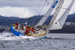 One DLL crew head up the Derwent River towards the line at the end of the Clipper Round the World race, a category of the Sydney to Hobart yacht race at Constitution Dock in Hobart, Monday, Dec. 30, 2013. (AAP Image/Heath Holden) NO ARCHIVING, EDITORIAL USE ONLY