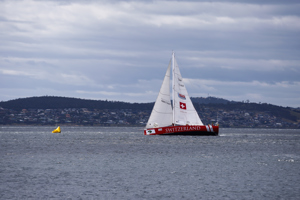 Switzerland crosses the finish line at the end of the Clipper Round the World race, a category of the Sydney to Hobart yacht race at Constitution Dock in Hobart, Monday, Dec. 30, 2013. (AAP Image/Heath Holden) NO ARCHIVING, EDITORIAL USE ONLY