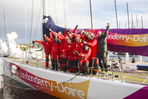 The crew of Derry~Londonderry~Doire celebrate being the first to sail up the Derwent river as a part of the Clipper Round the World race, a category of the Sydney to Hobart yacht race at Constitution Dock in Hobart, Monday, Dec. 30, 2013. (AAP Image/Heath Holden) NO ARCHIVING, EDITORIAL USE ONLY