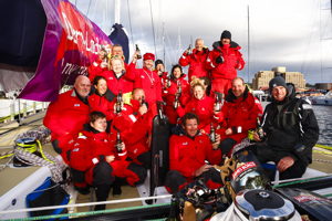The crew of Derry~Londonderry~Doire celebrate being the first to sail up the Derwent river as a part of the Clipper Round the World race, a category of the Sydney to Hobart yacht race at Constitution Dock in Hobart, Monday, Dec. 30, 2013. (AAP Image/Heath Holden) NO ARCHIVING, EDITORIAL USE ONLY