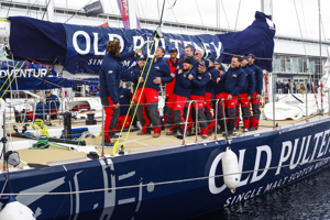 The Old Pulteney crew celebrate dockside at the end of the Clipper Round the World race, a category of the Sydney to Hobart yacht race at Constitution Dock in Hobart, Monday, Dec. 30, 2013. (AAP Image/Heath Holden) NO ARCHIVING, EDITORIAL USE ONLY