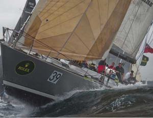 Lion New Zealand, skippered by Alistair Moore, making their way through Sydney Heads