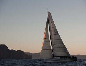 Niklas Zennstrom's JV72 RAN passing Cape Raoul at sunrise