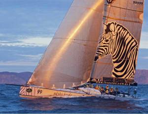 INVESTEC LOYAL catches the sunset off Tasman Island