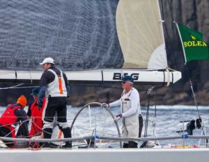 Roger Hickman at the helm of Vamp, passing the Organ Pipes