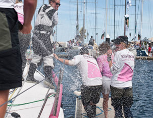 Jessica Watson receives a dunking from fellow crew member Will Broughton