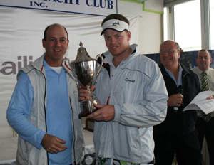 Sam Newman, crew member of Quest accepting the trophy