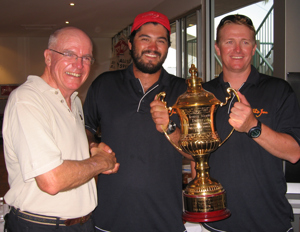CYCA Commodore Geoff Lavis congratulates the crew of Wild Joe on their IRC overall win