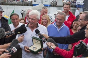 Roger Hickman, Owner Wild Rose, and crew receive the Tattersall's Cup and a Rolex Timepiece.
Front row: Richard Batt,  Commodore Royal Yacht Club of Tasmania, John Cameron, Commodore Cruising Yacht Club of Australia, Roger Hickman, Jean-Nöel Bioul, Rolex SA.