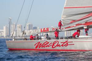 The crew of Wild oats XI flaking the main after finishing